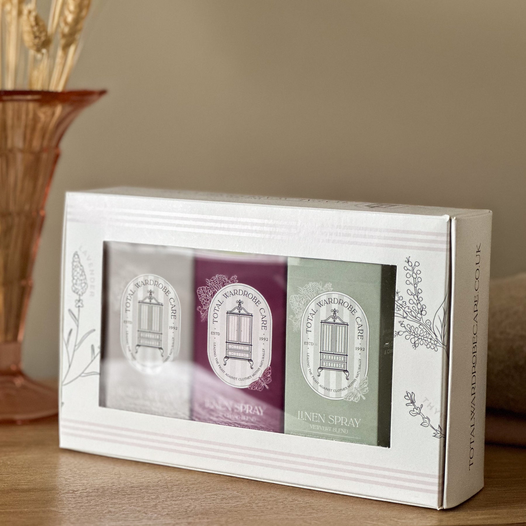 Sealed branded packaging for anti-moth linen spray trio in colourful boxes inside