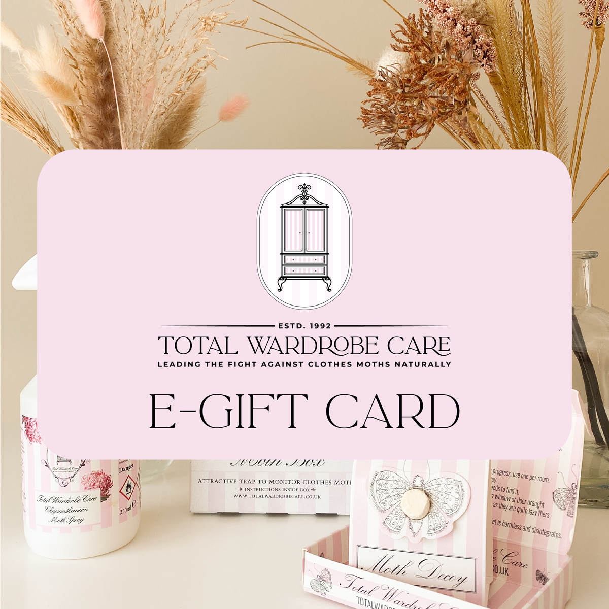 Pink e-gift card banner over image of Total Wardrobe Care products