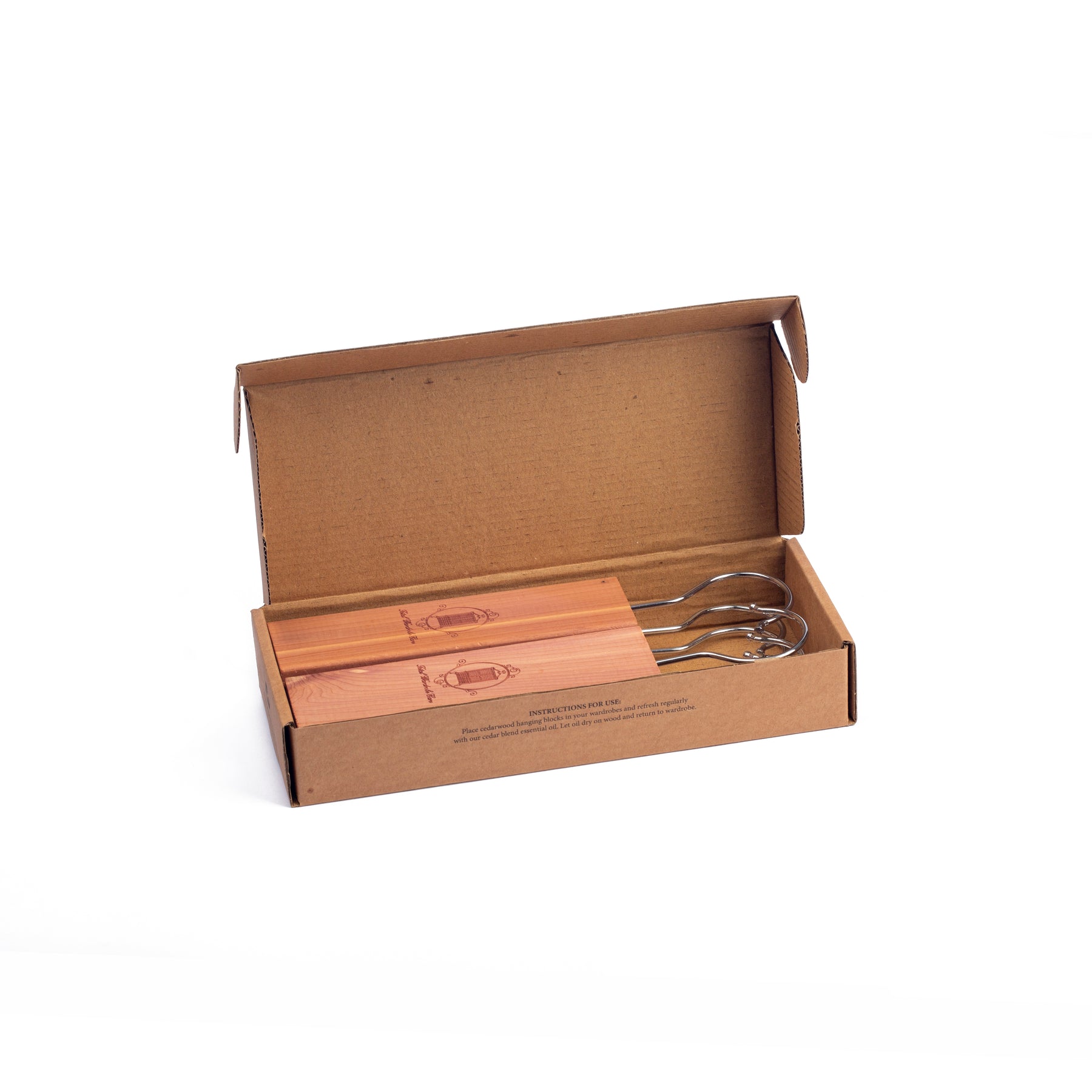 Open cardboard box containing cedarwood hanging blocks