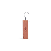 Single cedarwood hanging block stood with white background