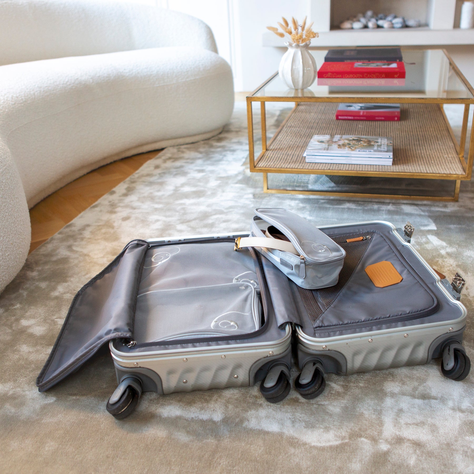 Travel packing cubes to inside of open suitcase