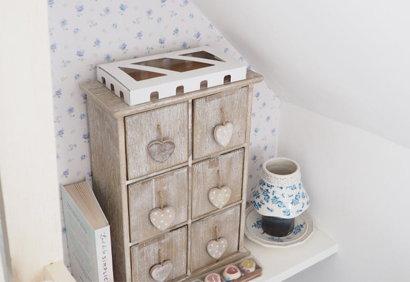 Moth trap box to top of drawer unit in bedroom