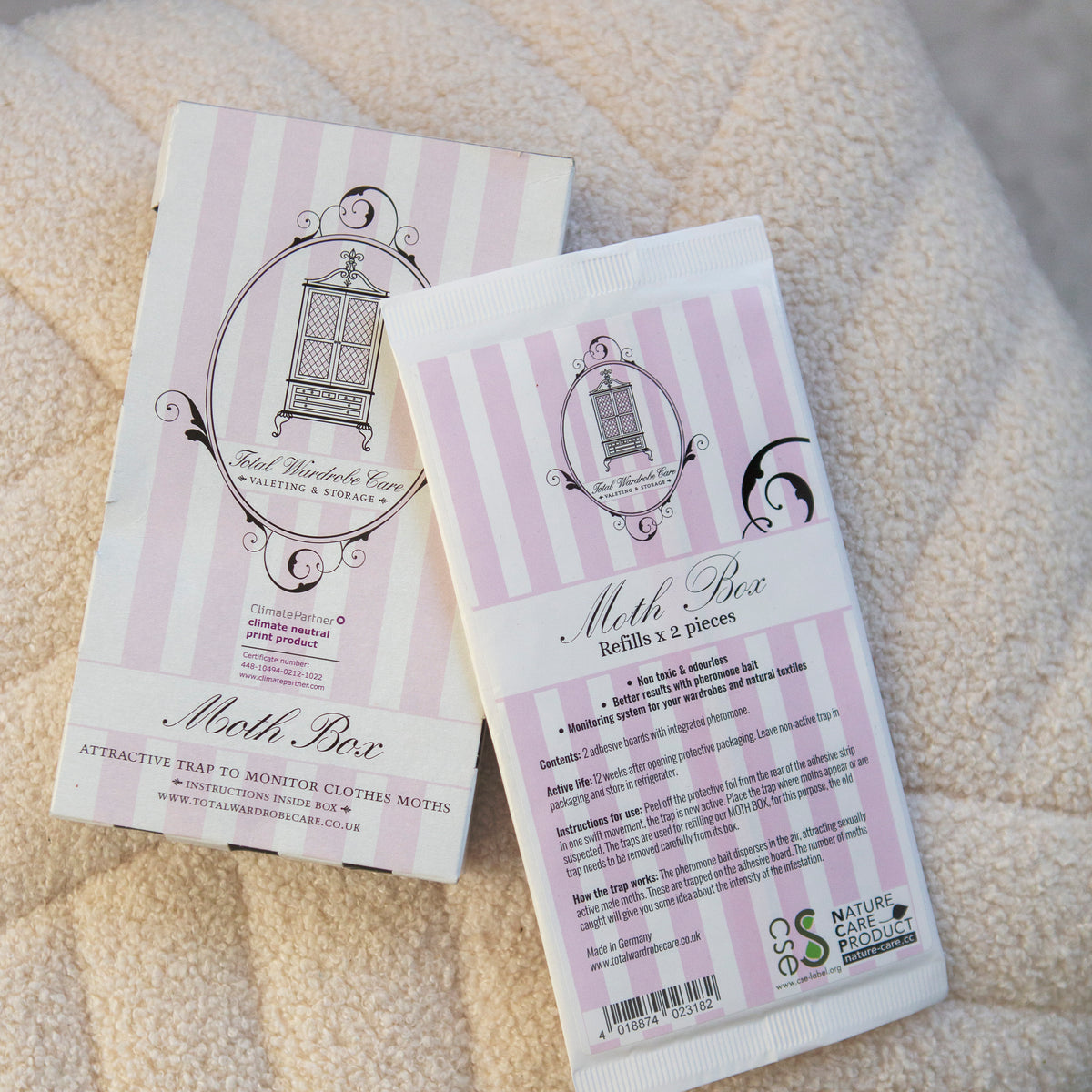 Pink and white packaging for Moth Box refills which contain two