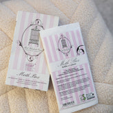 Pink and white packaging for Moth Box refills which contain two