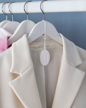 White blazer with white ceramic hanger 