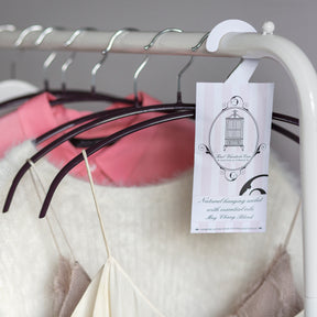 May Chang blend hanging sachet on clothes rail beside Chinese knot hangers