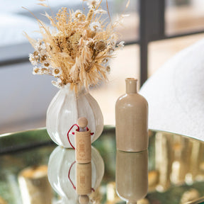 Wooden diffuser cup on glass table