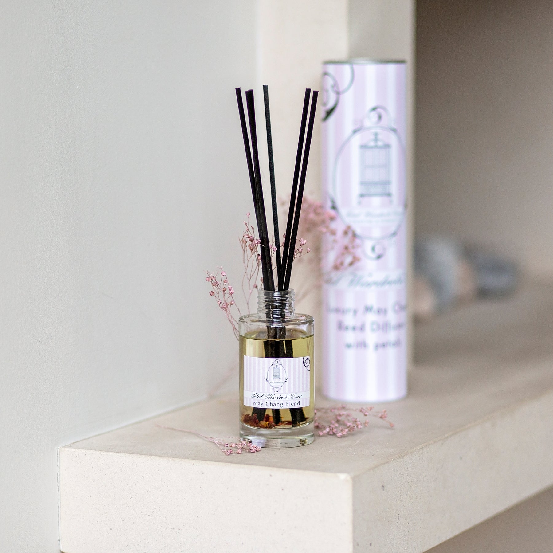 Luxury May Chang Reed Diffuser beside container tube 