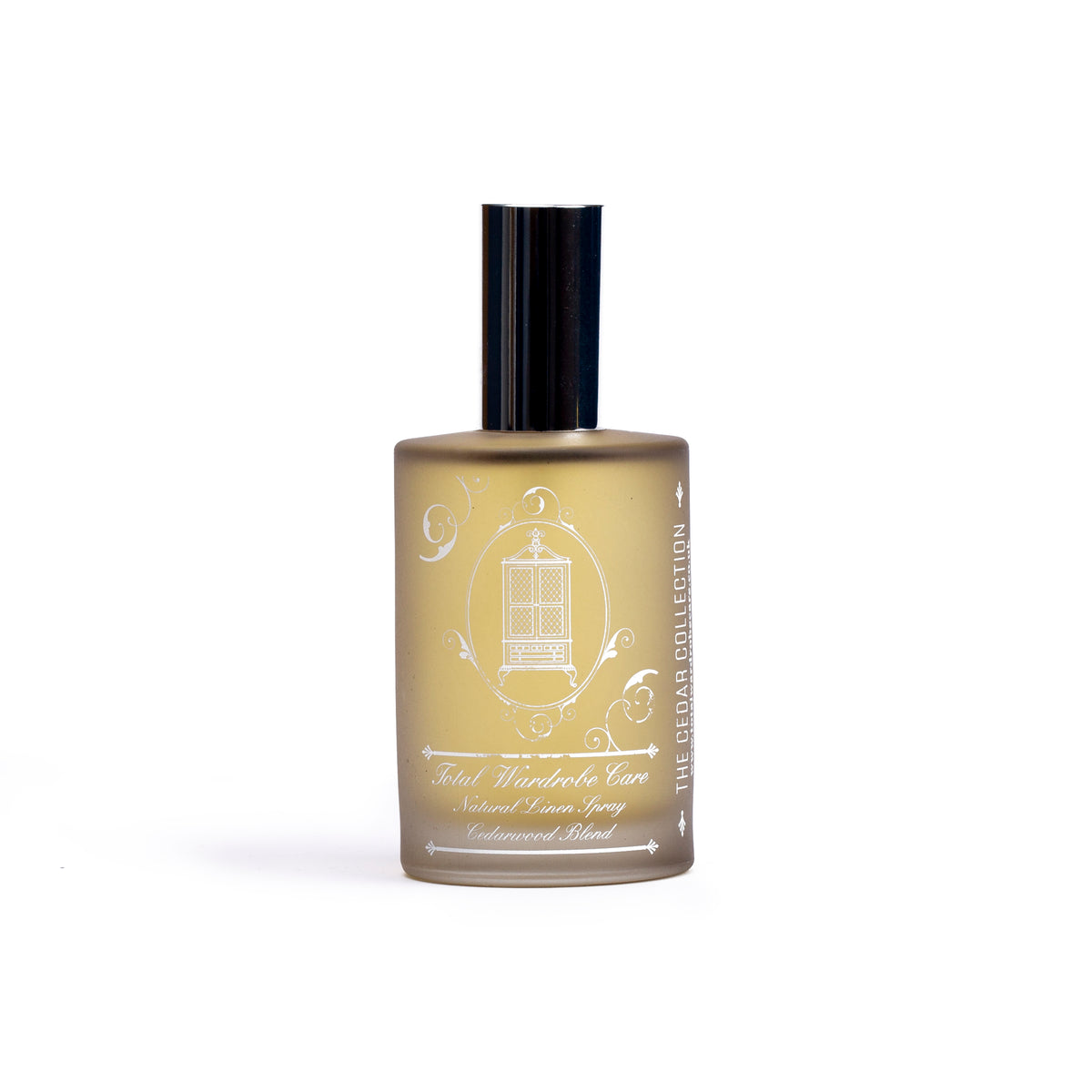 Cedar collection linen spray on white background in golden bottle